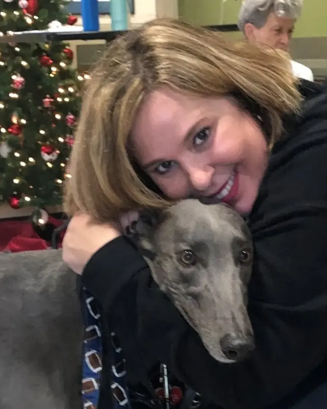 Maverick the greyhound with his handler