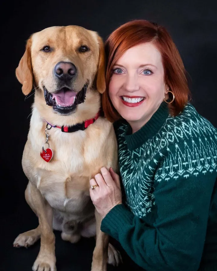 Cody, a yellow Labrador Retriever, with handler Mary Karen
